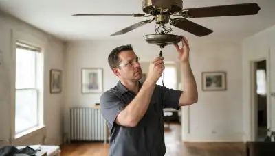 Baltimore, MD electrician tests ceiling fan pull-chain switch with a multimeter for fault diagnosis