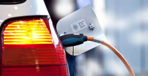 Electric car plugged into EV charger after professional installation in Baltimore, MD