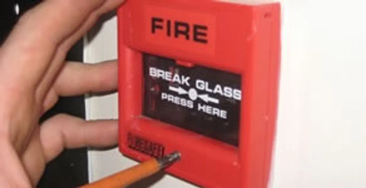 fire alarm installation service showing manual fire alarm pull station installed by licensed electricians in Baltimore, MD