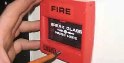 fire alarm installation service showing manual fire alarm pull station installed by licensed electricians in Baltimore, MD