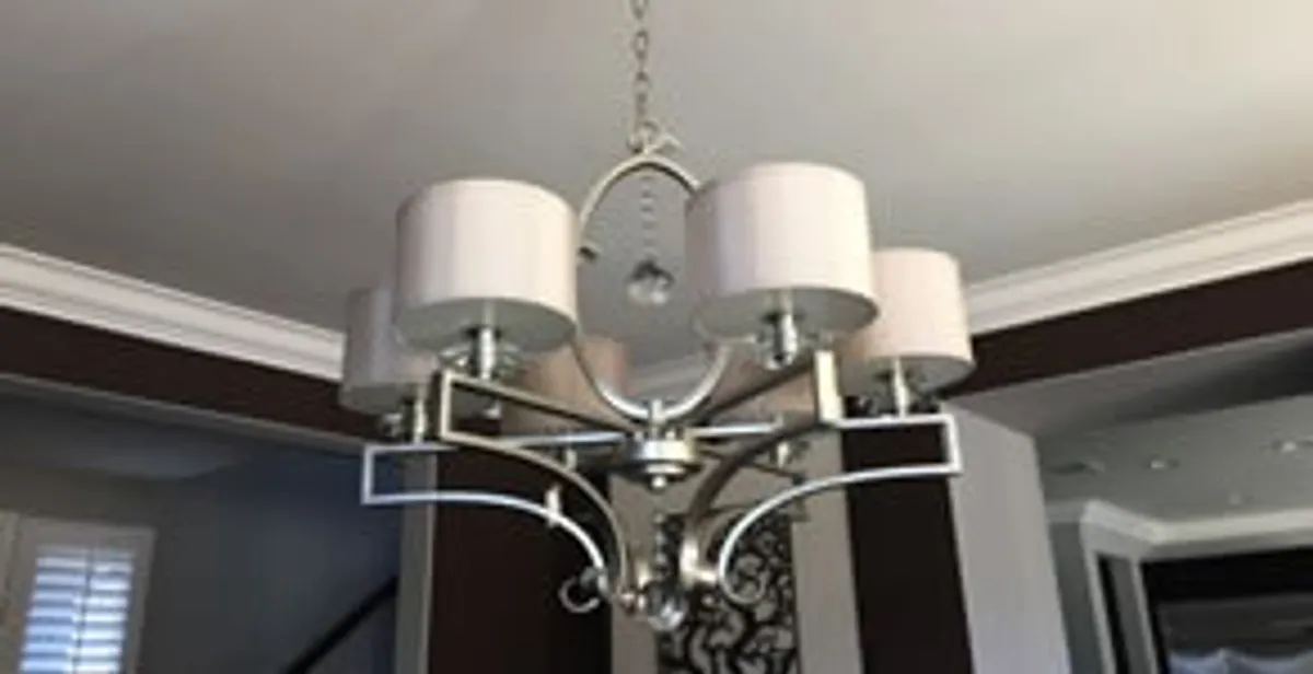 Modern chandelier installation with multiple light fixtures in Baltimore, MD