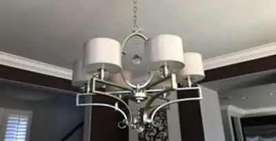 Modern chandelier installation with multiple light fixtures in Baltimore, MD